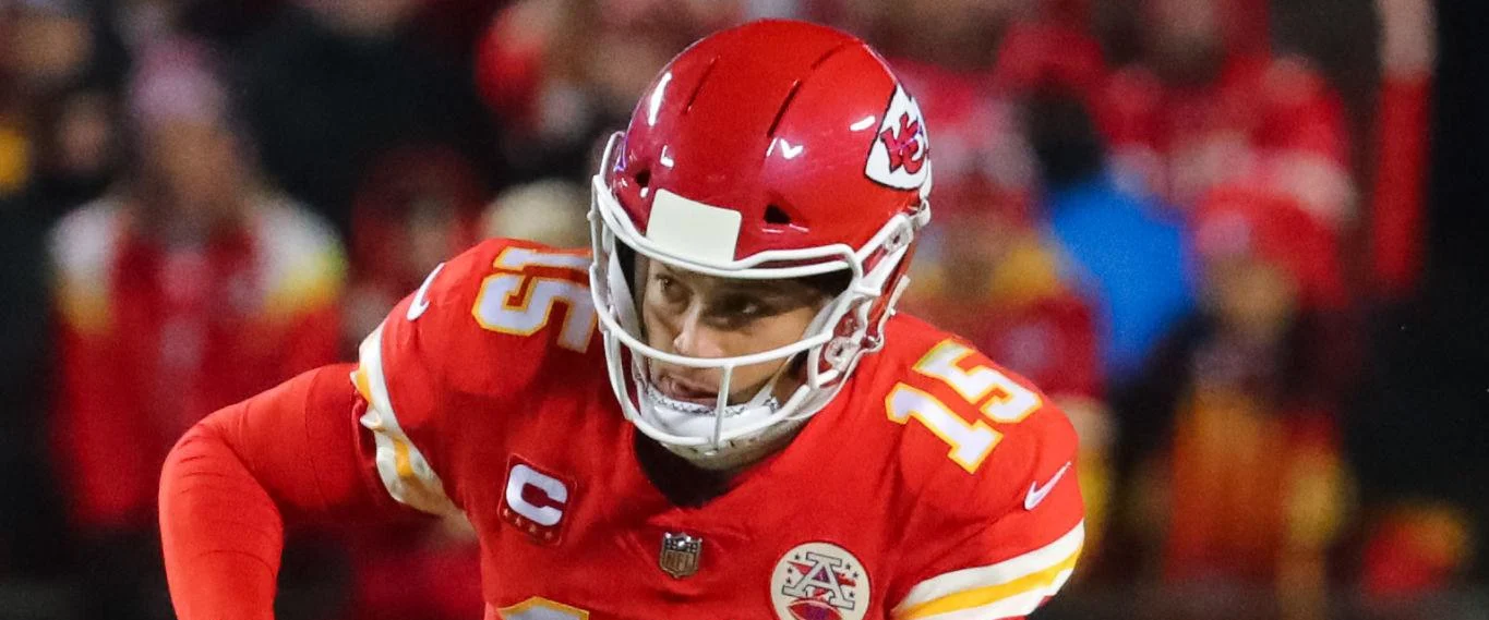 A Kansas City Chiefs quarterback rolling out at Arrowhead
